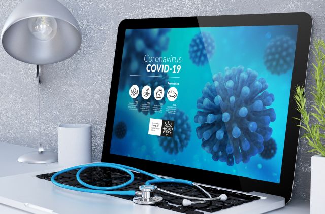 medical desktop computer with covid-19 info